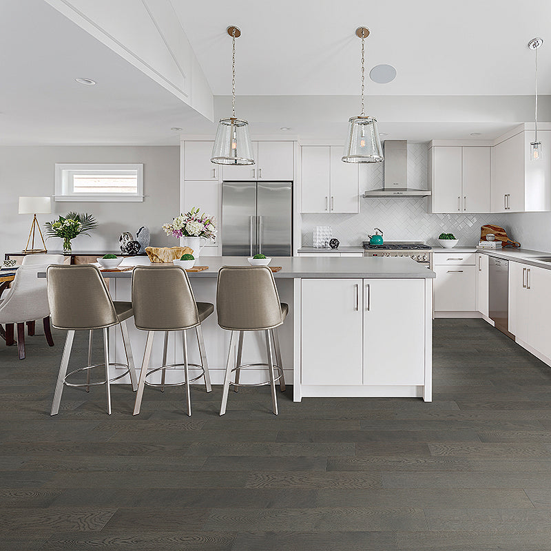 Dark-stained oak wood flooring with a matte finish and visible natural grain patterns, arranged in a staggered plank layout.