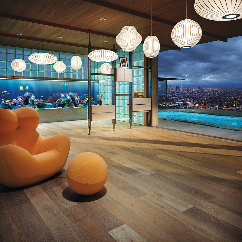 photo of wide planked flooring in caramel mid-tone brown with lighter white grain