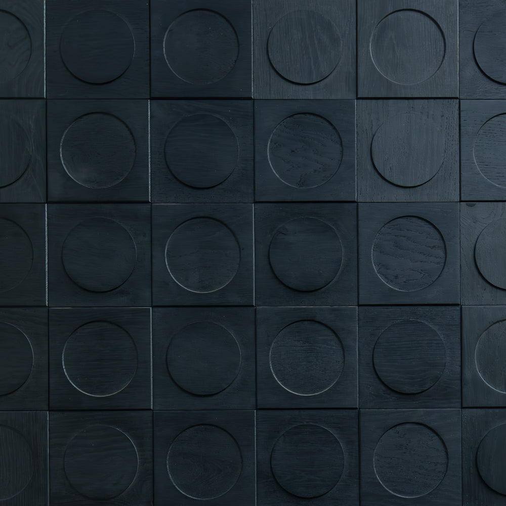 Wooden panel with circular recesses arranged in a grid pattern