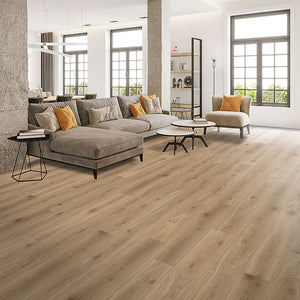 Mid toned oak grain laminate floor installed throughout a casual modern main floor