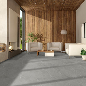 Stone look luxury vinyl tiles in a minimalist living room with fireplace and wood paneling