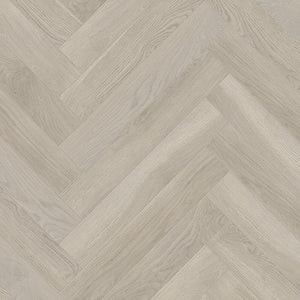 Light wood herringbone patterned flooring with subtle grain texture in soft beige and grey tones.