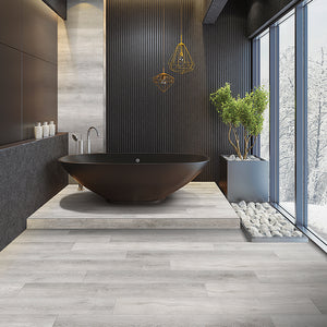 Moondance Loose Lay Vinyl Plank Flooring from the Journey Collection by Divine installed in a modern bathroom with floor to ceiling windows