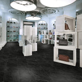 Retail hand-bag boutique with Bombshell black marble luxury vinyl tile flooring
