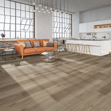 Burning Cain XL Luxury Vinyl Flooring in an industrial loft with tan leather couch and white kitchen cabinets