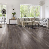 Quest North Face Walnut Luxury Vinyl in a cozy living room with large windows